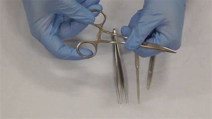 How do you hold suture instruments