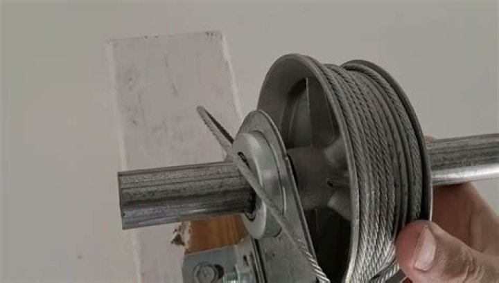 How do you open a garage door when the cable is broken
