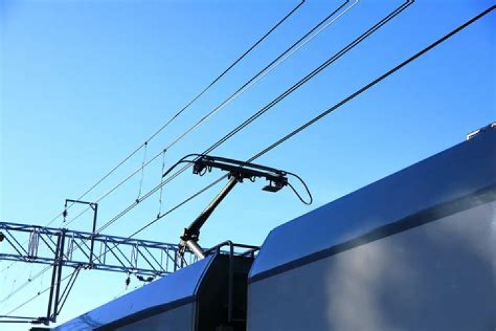 What are the wires above trains for
